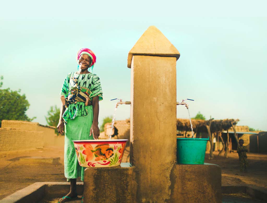 A woman next to a fountain